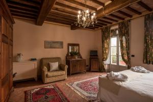 Postel nebo postele na pokoji v ubytování Agriturismo Podere La Rocca