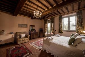 Postel nebo postele na pokoji v ubytování Agriturismo Podere La Rocca