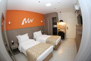 Cama ou camas em um quarto em Real Classic Bahia Hotel