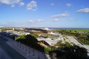 a view of a city with a road and buildings at Welcome Here - Danubio - Parque das Nações in Lisbon