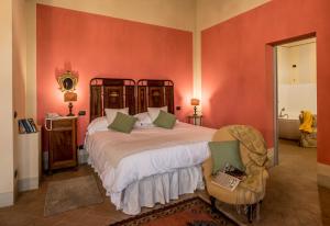 Postel nebo postele na pokoji v ubytování Agriturismo Podere La Rocca