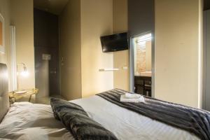 Postel nebo postele na pokoji v ubytování Cosy Rooms Tapinería
