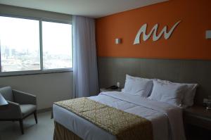 Cama ou camas em um quarto em Real Classic Bahia Hotel
