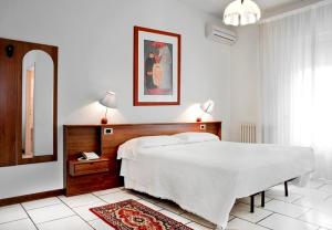Postel nebo postele na pokoji v ubytování Hotel Miramonti
