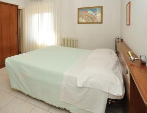 Postel nebo postele na pokoji v ubytování Hotel Miramonti