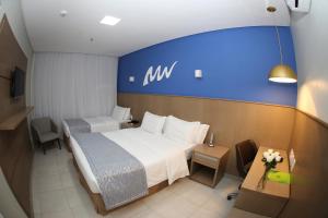 Cama ou camas em um quarto em Real Classic Bahia Hotel