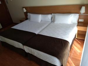 Кровать или кровати в номере Hotel Avión by Bossh! Hotels