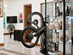 a wheel in a display case in a room at Hotel Miramonti in Montecatini Terme