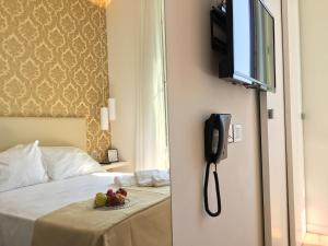TV a/nebo společenská místnost v ubytování Sanremo Luxury Suites