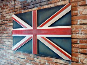 a flag on the side of a brick wall at Eye of London @ Central Malacca in Malacca