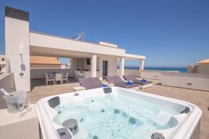 a hot tub on the roof of a house at Son Serra de Marina - 1930-45 Mallorca in Son Serra de Marina