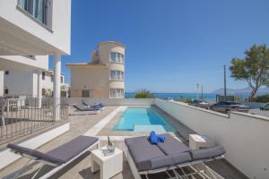 a swimming pool on the roof of a house at Son Serra de Marina - 1930-45 Mallorca in Son Serra de Marina