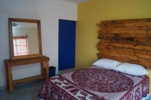 Voodi või voodid majutusasutuse Hostal Las Cruces toas