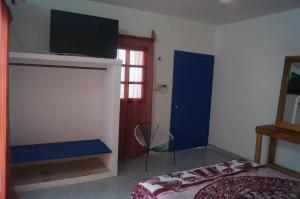 Voodi või voodid majutusasutuse Hostal Las Cruces toas