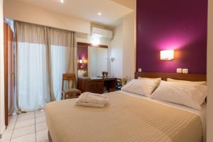 Katil atau katil-katil dalam bilik di Epidavros Hotel