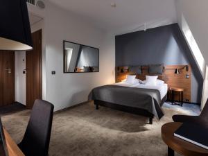 Postel nebo postele na pokoji v ubytování Hotel Sadova