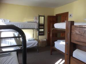 a room with several bunk beds in a dorm at Washington International Student Center in Washington