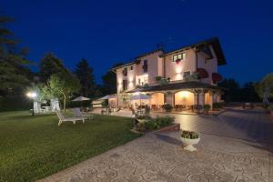 a large building with a courtyard at night at Villa ai Tigli Venezia GUEST HOUSE in Tessera