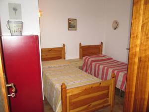 Postel nebo postele na pokoji v ubytování Casa La Forsizia