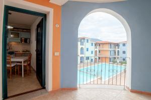 a view from the hallway of a apartment with a balcony at Casa Vacanza Sardegna in Valledoria