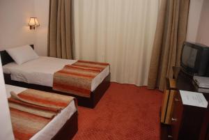 Voodi või voodid majutusasutuse EL Tonsy Hotel toas