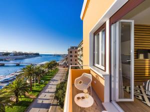 a balcony with a view of the water at Apartments Withlove Zadar in Zadar