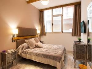 A bed or beds in a room at La Barca M&B II studio close to Las Canteras
