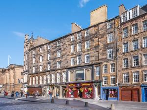 a large brick building on a city street at Festival Lets in Edinburgh