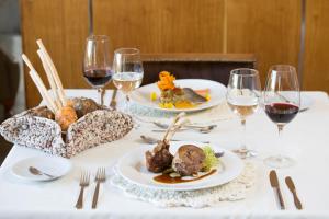 a white table topped with plates of food at Esplendor by Wyndham El Calafate in El Calafate