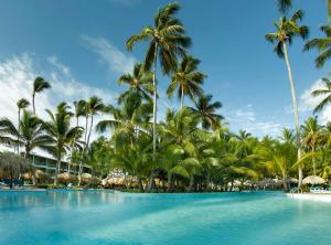 
a beach with palm trees and palm trees at Grand Palladium Punta Cana Resort & Spa - All Inclusive in Punta Cana

