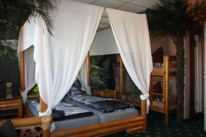 Postel nebo postele na pokoji v ubytování Hotel Berlin