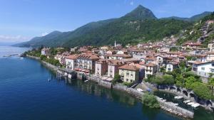 an aerial view of a town on the water at casa ubaldo in Cannero Riviera
