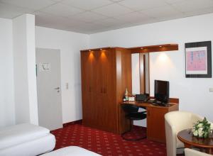 Postel nebo postele na pokoji v ubytování Hotel Berlin