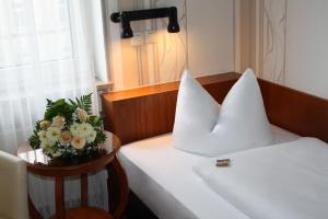 Postel nebo postele na pokoji v ubytování Hotel Berlin
