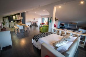 a bedroom with a bed and a kitchen and a living room at Casa Rural Arraigorri in Hernani