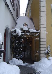 an entrance to a building covered in snow at Hotel Alte Post in Wangen im Allgäu