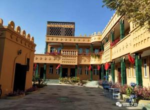 a courtyard of a building with a building at Turpan Silk Road Lodges - The Vines in Turfan