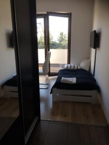 Ένα ή περισσότερα κρεβάτια σε δωμάτιο στο Apartament Fibra Mocca