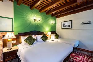 Postelja oz. postelje v sobi nastanitve Yeng Keng Hotel