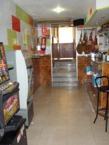 a room with a video game in a restaurant at Hostal Mays in Numancia de la Sagra