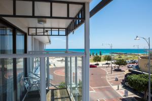 a large building with a view of the ocean at Ocean Centre Hotel in Geraldton