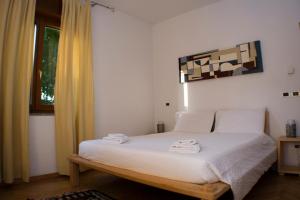 A bed or beds in a room at Casa Martello