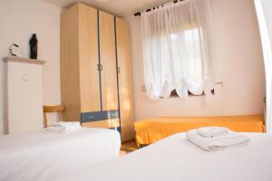 A bed or beds in a room at Casa Martello