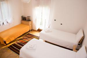 A bed or beds in a room at Casa Martello