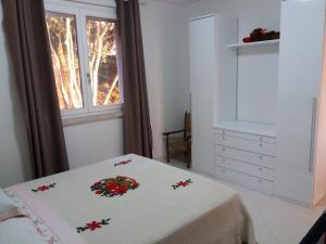 a bedroom with a bed and a window at Bicchi Belvedere Scarlino in Scarlino