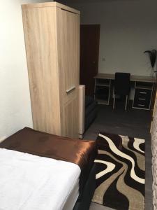 Postel nebo postele na pokoji v ubytování Hotel am Brünnchen