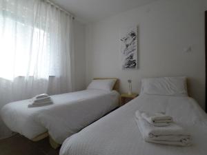 A bed or beds in a room at Casa Martello