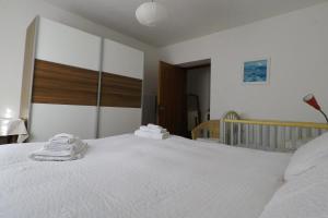 A bed or beds in a room at Casa Martello