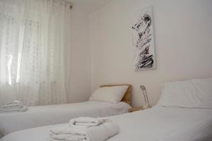 A bed or beds in a room at Casa Martello