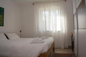 A bed or beds in a room at Casa Martello